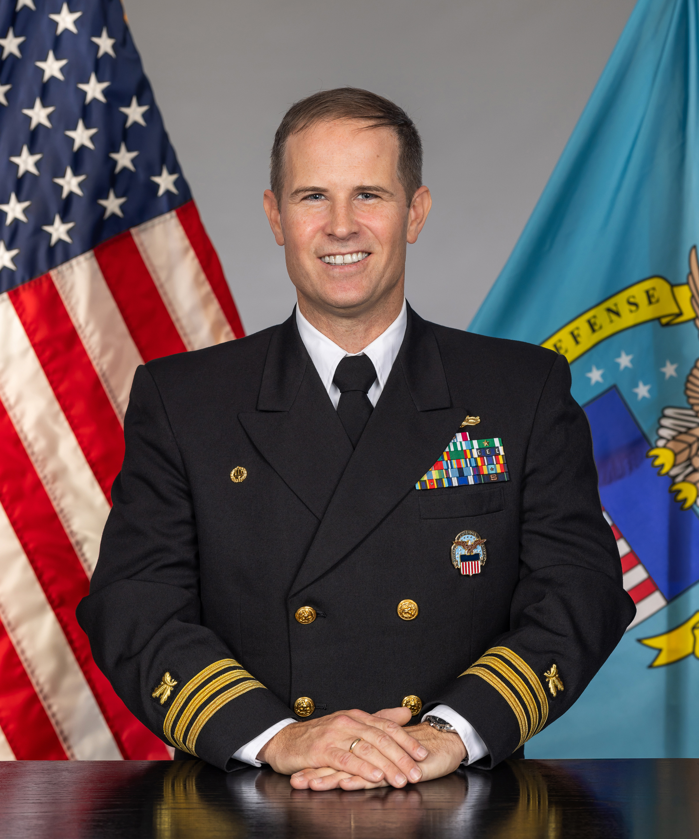 Cmdr. James R. Marsh, SC, USN, Commander
